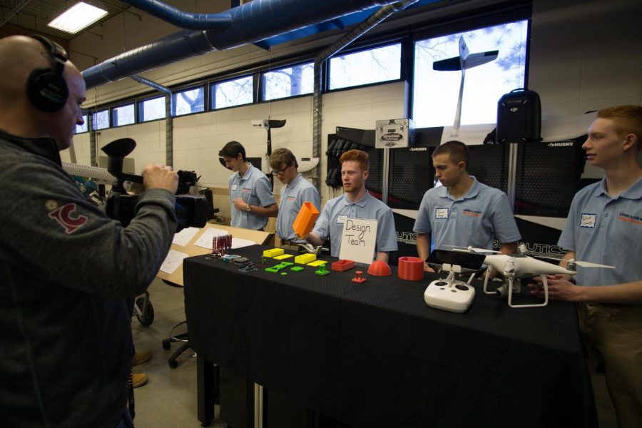 The design team presents their work to representatives from MIT as a part of their requirements in the grant.