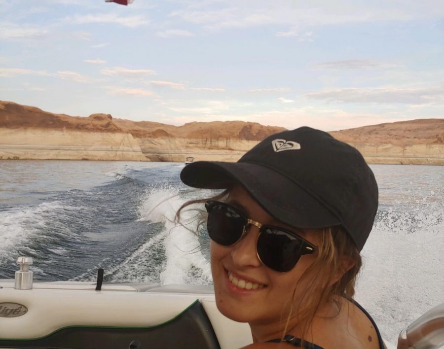 Hannah enjoys a nice day out on the lake as she drives her billion dollar yacht
