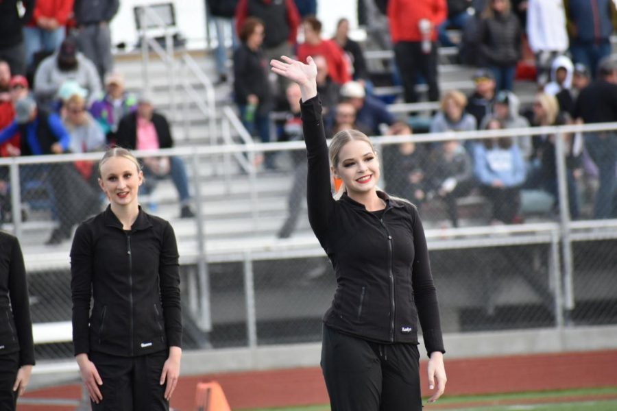 Kaelyn Decker being introduced at the halftime show, preparing to preform their hip-hop routine.