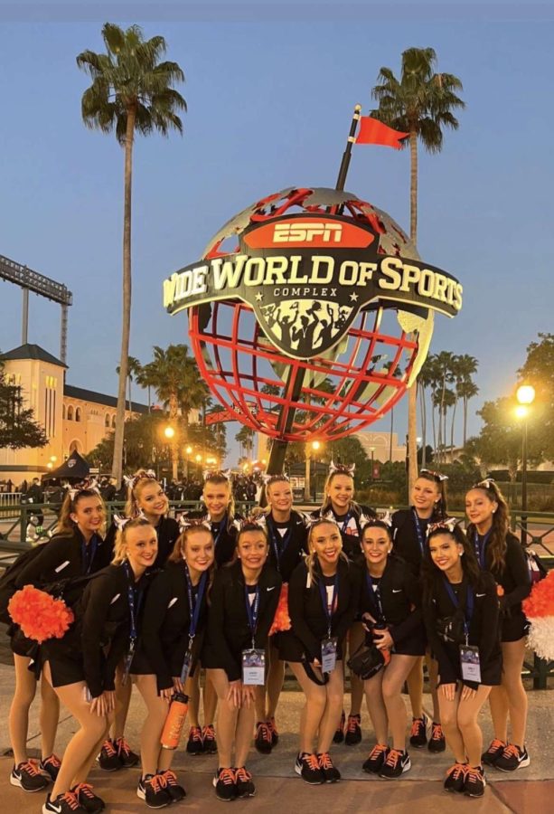 The Erie Tiger Poms taking a group picture in front of the ESPN Wide World of Sports in Disney World