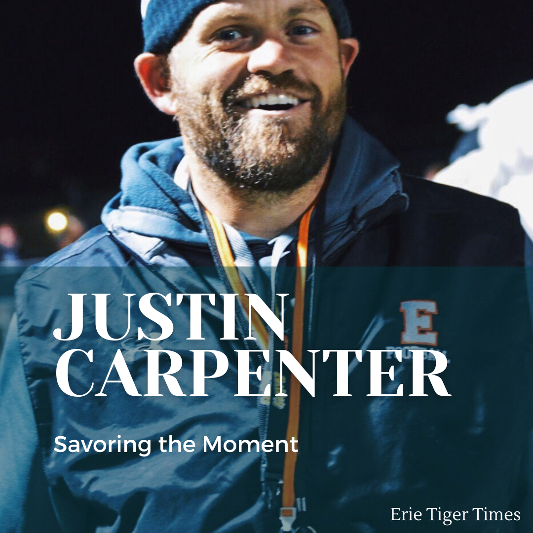 Justin Carpenter smiling at a football game. 